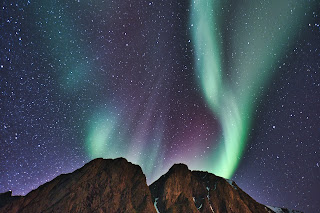 Aurora Borealis over Mountain - Photo by Matt Houghton on Unsplash