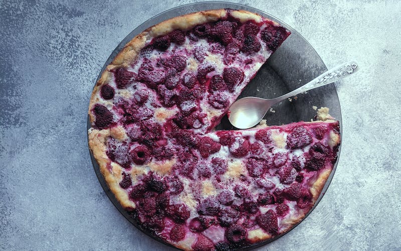 blueberry pie with a silver spoon