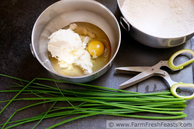 Creamy ricotta cheese and fresh chives are the highlight of these savory muffins. Adding potato flakes to the batter, and using bacon grease takes the flavor of this quick bread over the top.