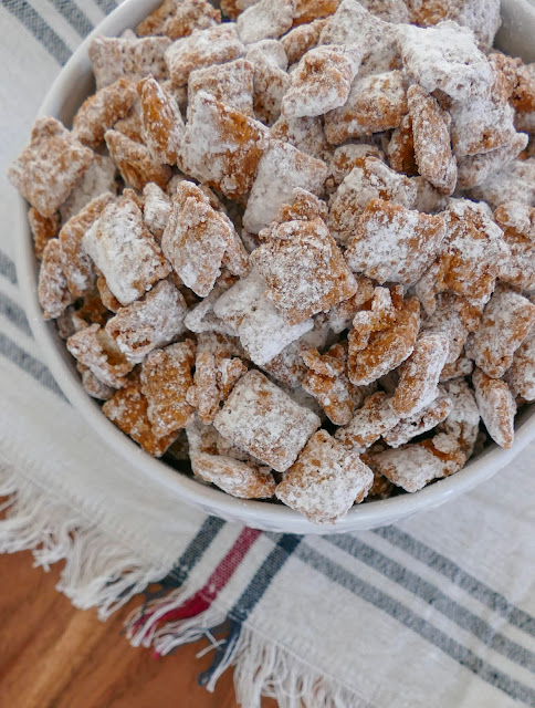 Muddy Buddies with wood and white napkin background.