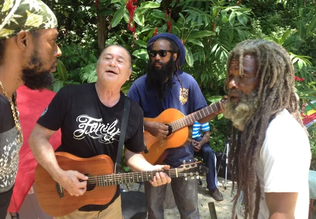 Four people singing in jamaica