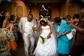 Bride and groom thrown with confetti - Joretha Taljaard Wedding Photography