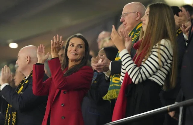 Queen Letizia wore a new Jaline red blazer suit by Hugo Boss. Infanta Sofia wore a cashmere coat and stripe sweater