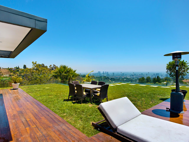 Photo of outdoor furniture on the lawn in the backyard of modern Bel Air residence