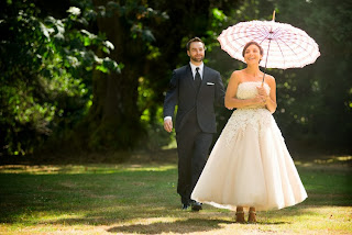 Travis & Victoria with her parasol - Ceremony officiated by Kent Buttars, Seattle Wedding Officiant