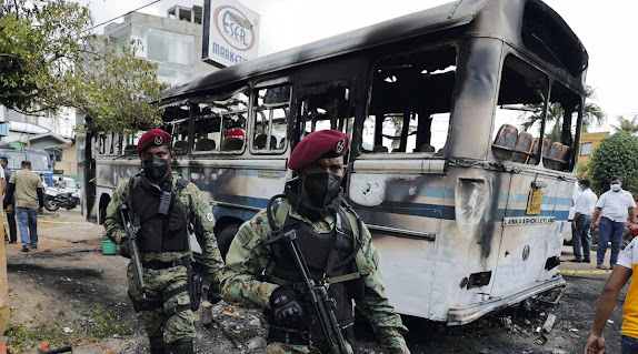 Bus damaged by angry protesters