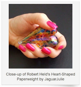 robert held confetti heart paperweight art glass