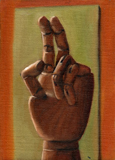Oil painting of a wooden artist's model hand, with middle and index fingers extended.