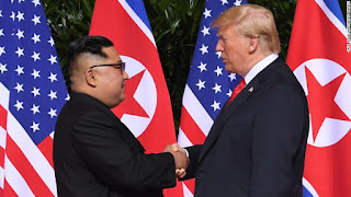 TRUMP KIM HANDSHAKE