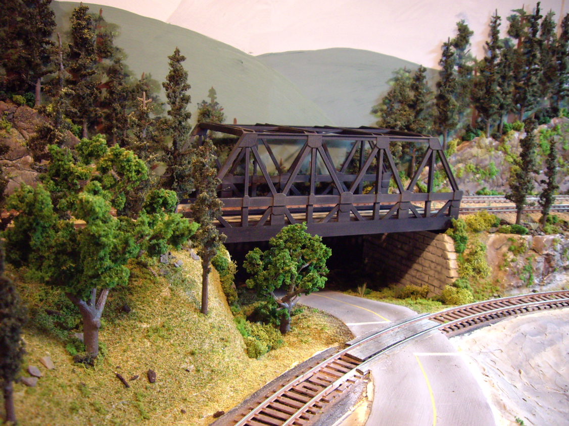 Upgraded warren-truss train bridge with almost-complete scenery