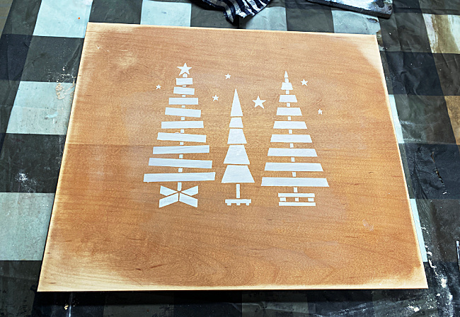 stenciled trees on sanded cabinet door