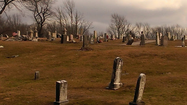 gray skies above cemetary