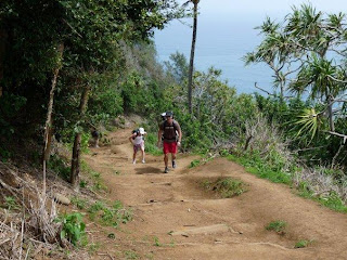 Pololu Valley hikers return from valley