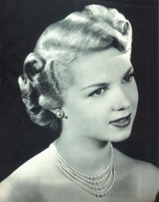 1940s hairstyles.  Victory Rolls. You know, in case I wanted to go as a Forties Housewife 