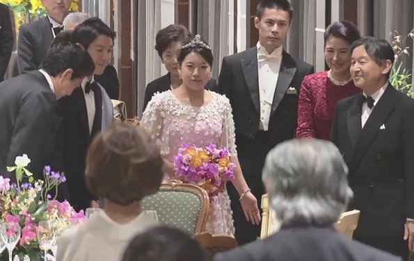 Crown Prince Naruhito and Crown Princess Masako at weeding banquet. Princess Ayako wore a pink silk dress designed by designer Norio Suzuki