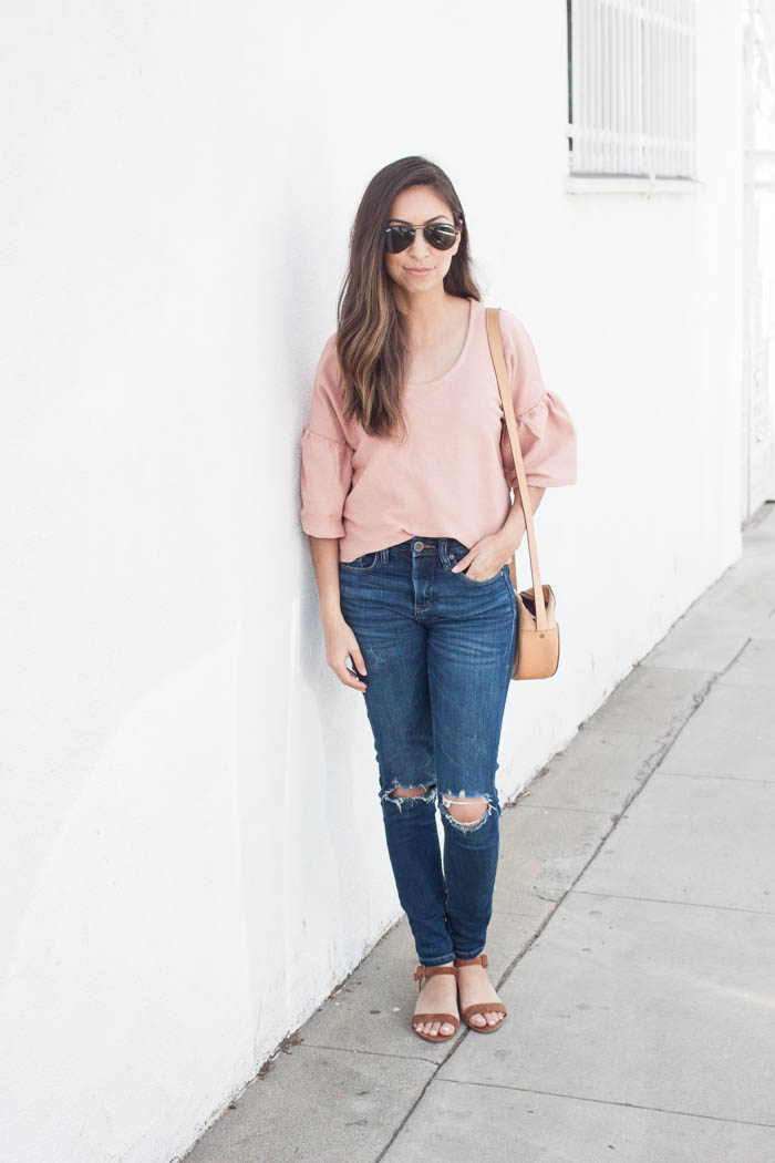 casual coral tee and ripped jeans