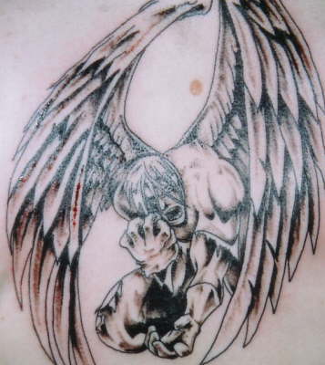 Scary fallen angel tattoo.