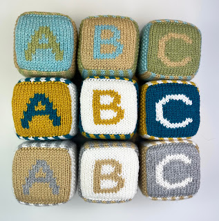 hand knit abc 123 foam blocks in gender neutral colors, pastel blue, green, yellow, teal white, gray