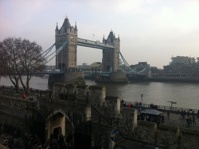 Walking along the walls of the Tower, enjoying a view of the Tower Bridge.