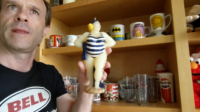 picture of a guy holding a vintage candle sculpture