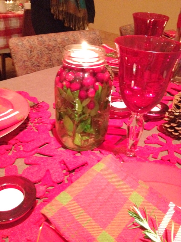 For the main centerpiece a tall cylinder vase was filled with red dogwood 