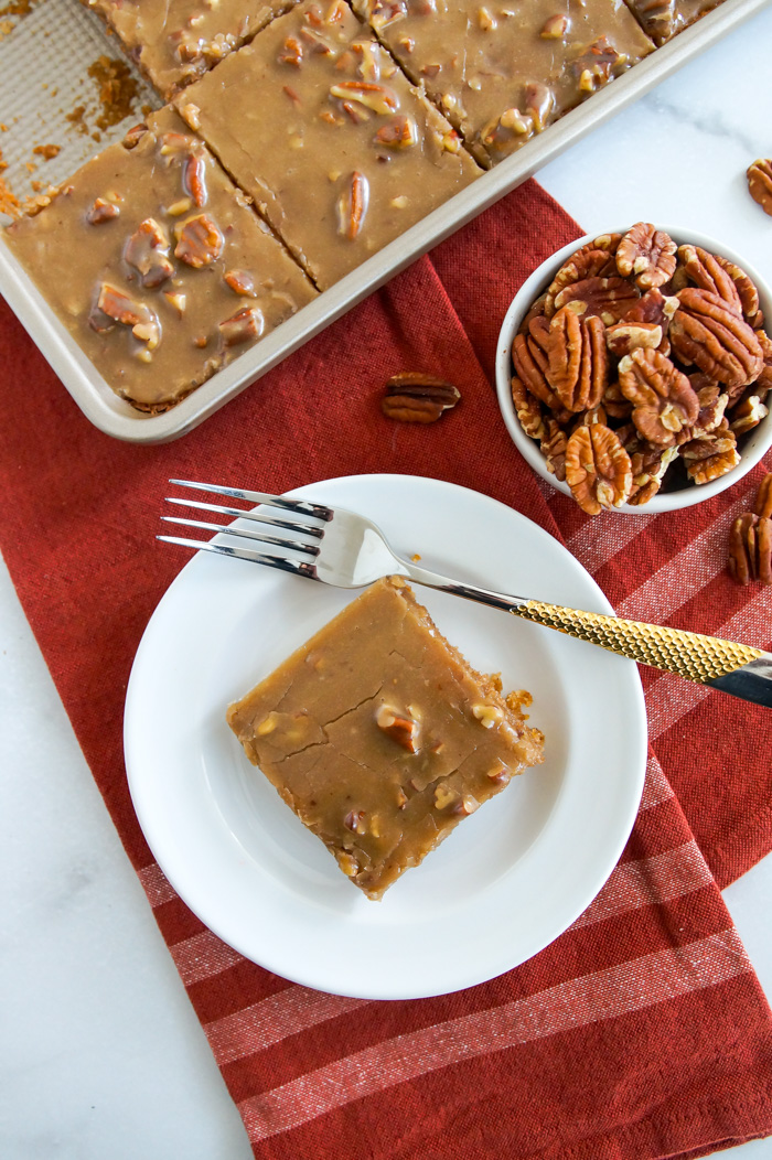 Maple Pecan Texas Sheet Cake with rust colored linen