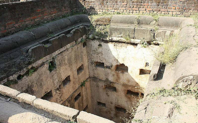 An ancient well in the courtyard of Shaniwarwada Fort