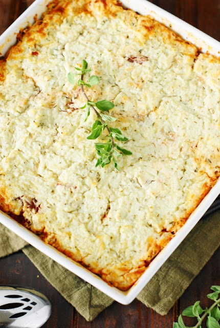 Baked Spaghetti Squash Gratin ~ Tender spaghetti squash topped with a quick-simmered tomato sauce & creamy, cheesy gratin topping.  So full of flavor you'll want to make it over and over!