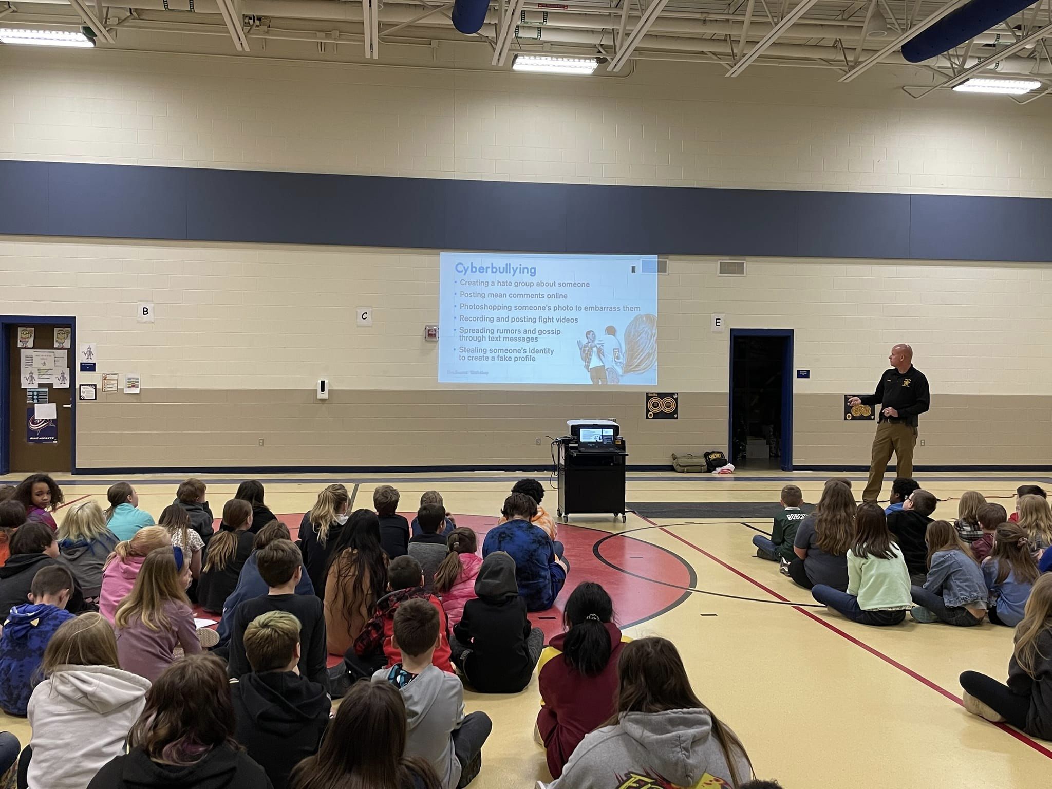 David Maple and Tiffany Hedrick talking to students on Cyber Safety