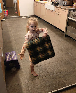 Rosie dancing with a cushion