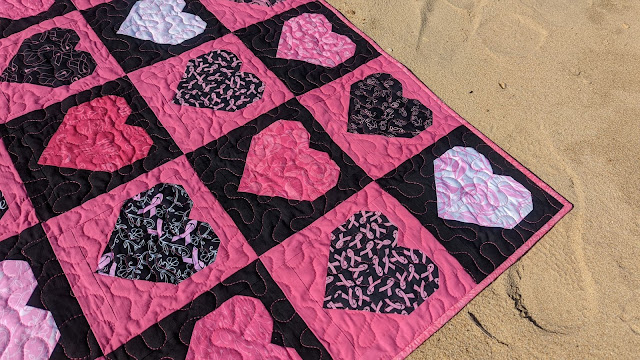 Pink and black heart quilt using breast cancer awareness fabric