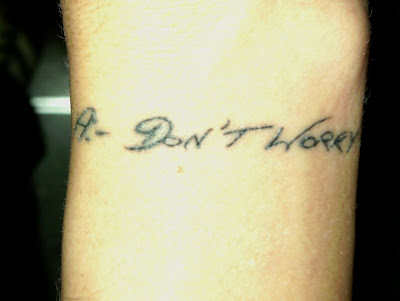  words on the inside of his wrist still healing from a recent inking