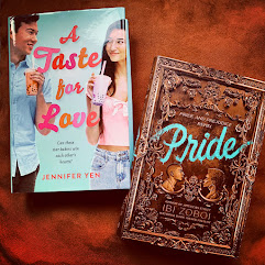 Two books on a cloth. A Taste for Love and Pride.
