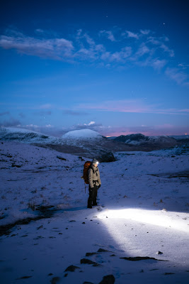 a picture of a hiker with The best Rechargeable Headlamp On The Market