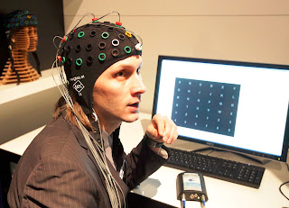 Image of a person using a Noninvasive BCI system