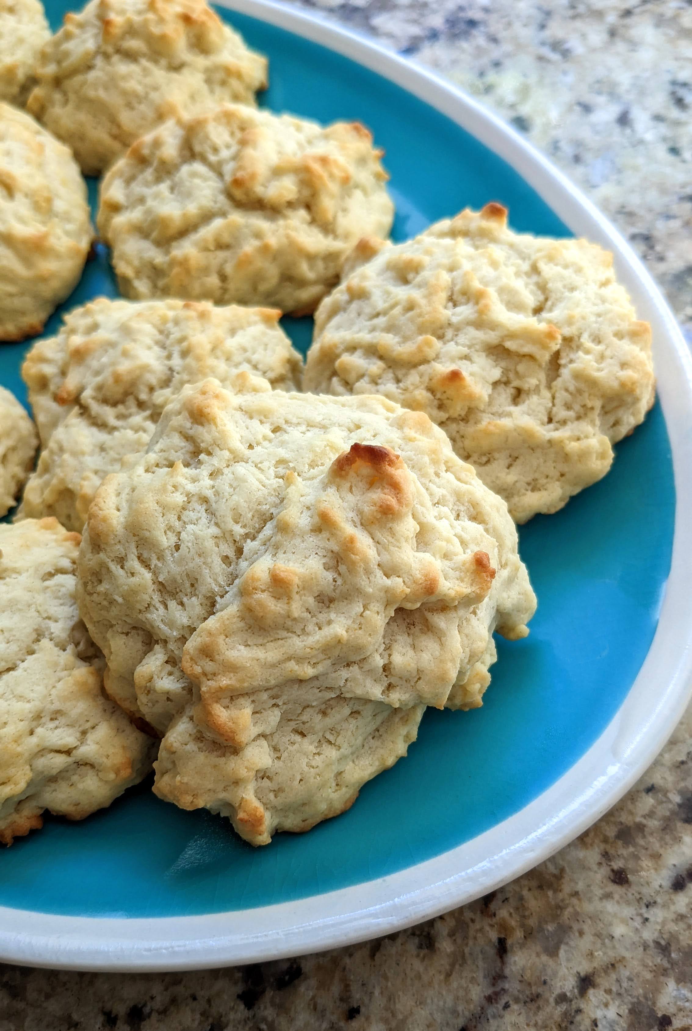 Simple Olive Oil Drop Biscuits on Teal Platter with White Rim | Taste As You Go