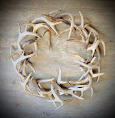 A wreath made with deer antlers.