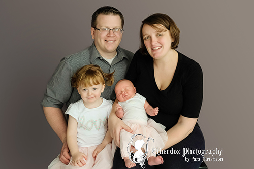 Professional portrait of a newborn baby using a round backdrop stand