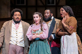 IN REVIEW: (from left to right) bass RAFAEL ALEJANDRO GARCIA as Krušina, soprano CLAIRE GRIFFIN as Mařenka, bass-baritone REGINALD POWELL as Kecal, and mezzo-soprano DANIELLE LEE DORSETT as Ludmila in UNCG Opera Theatre's 2022 production of Bedřich Smetana's PRODANÁ NEVĚSTA [Photograph © by UNCG Opera Theatre]