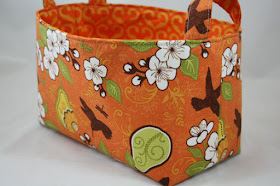 fabric bin, orange, with flowers and birds