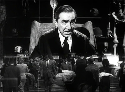Bela Lugosi as the scientist watches over a bustling city
