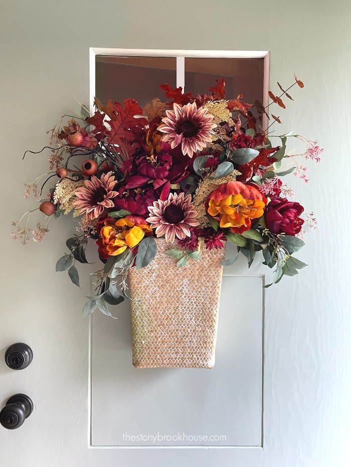 Adding sunflowers to front door basket