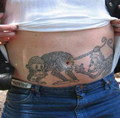 Then, hows the idea about tattooing your body. Two monkeys stomach tattoo.