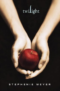 hands holding a red apple.