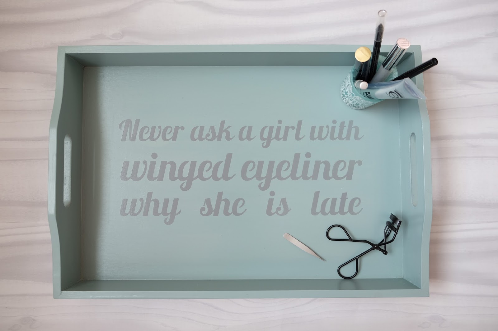 Tray stencilled with slogan Never ask a girl with winged eyeliner why she is late.  Cut with Silhouette Cameo using the free font for download from Silhouette UK Blog created by Nadine Muir from the Lobster font