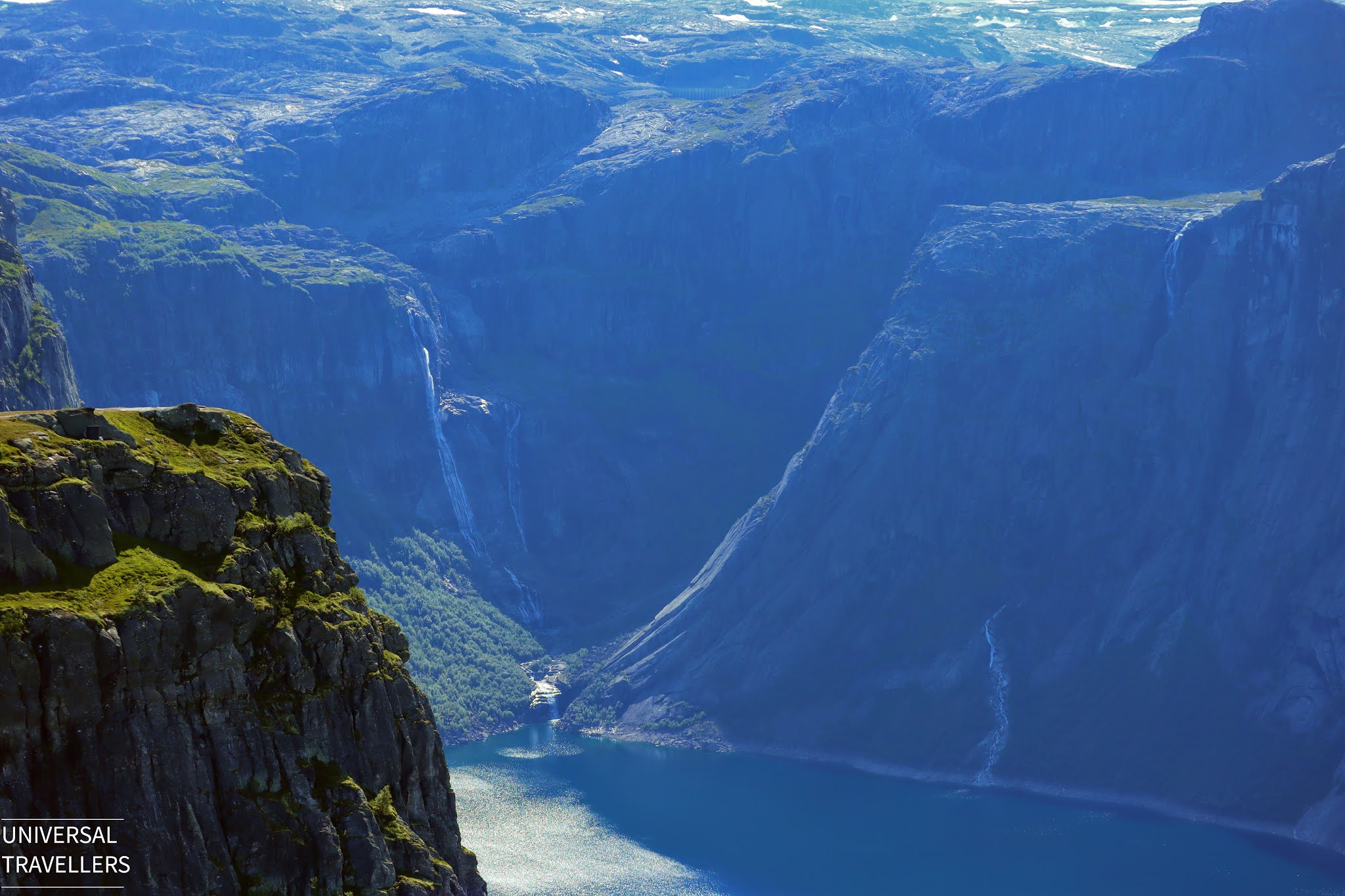 The view of Lake Ringedalsvatnet and surrounding waterfalls, from the walking path to Trolltunga