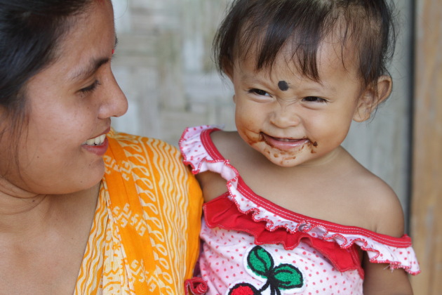 Mother and daughter - a beautiful moment at Panbari Mishing Tribal Village, Assam, Kaziranga, India