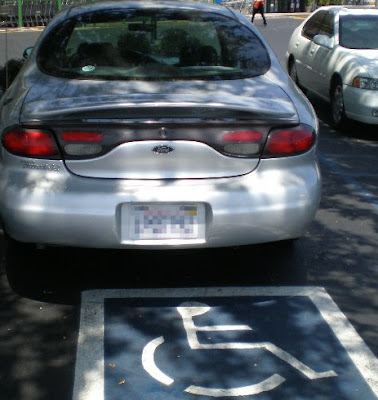 Car in handicap spot, photo by Rosemary West © 2009