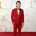 Simu Liu wearing a custom #AtelierVersace suit +  @Omega timepiece! to this year's #Oscars.