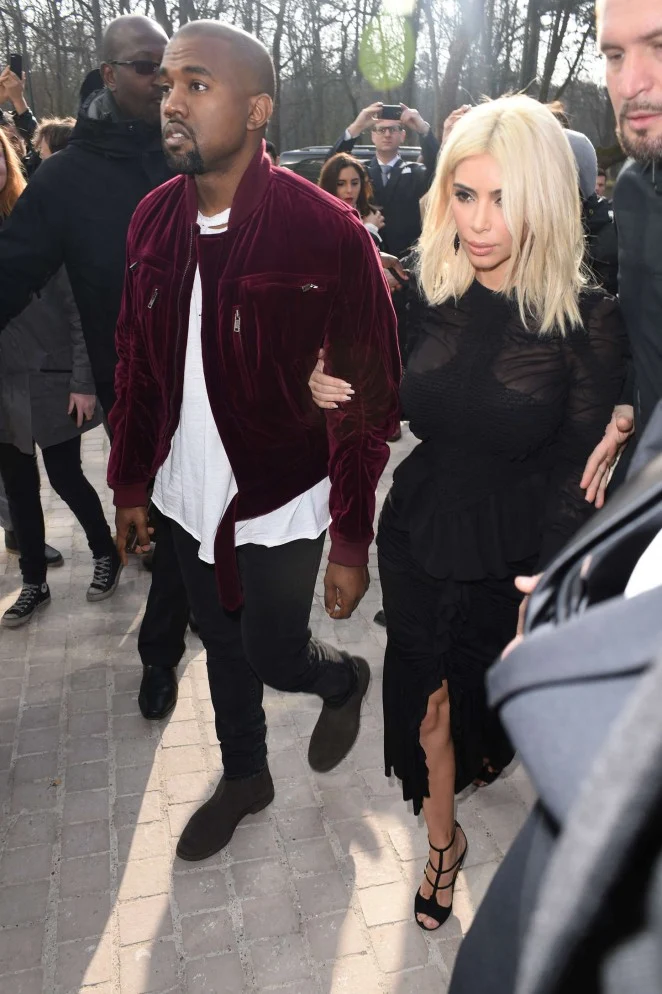 Kim Kardashian and Kanye West attend the Louis Vuitton Fall/Winter 2015 Paris Fashion Week Show